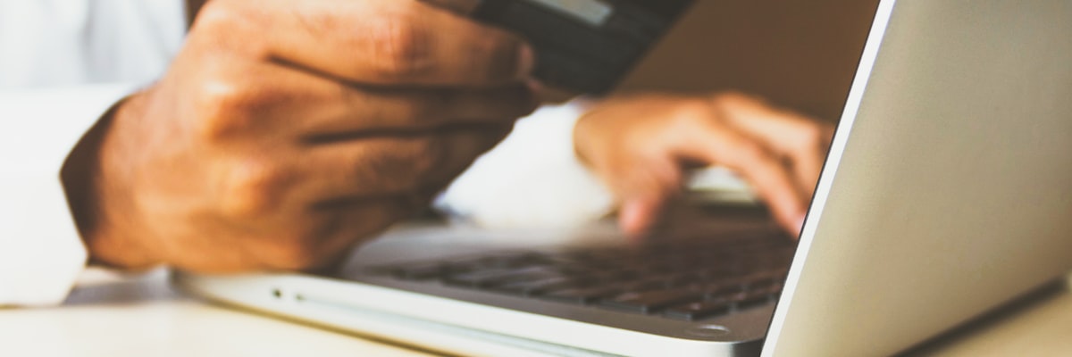 A person using a smartphone to complete a safe online banking transaction